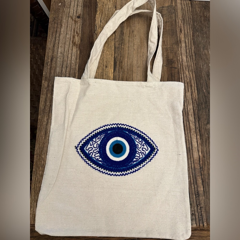 Brand new evil eye canvas tote bags.